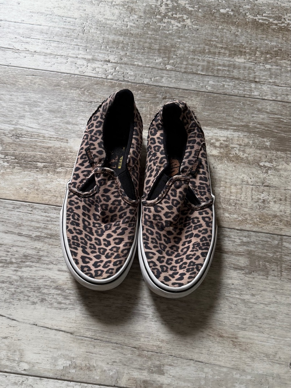 Vans Leopard Print Slip-On Sneakers in Brown and Black